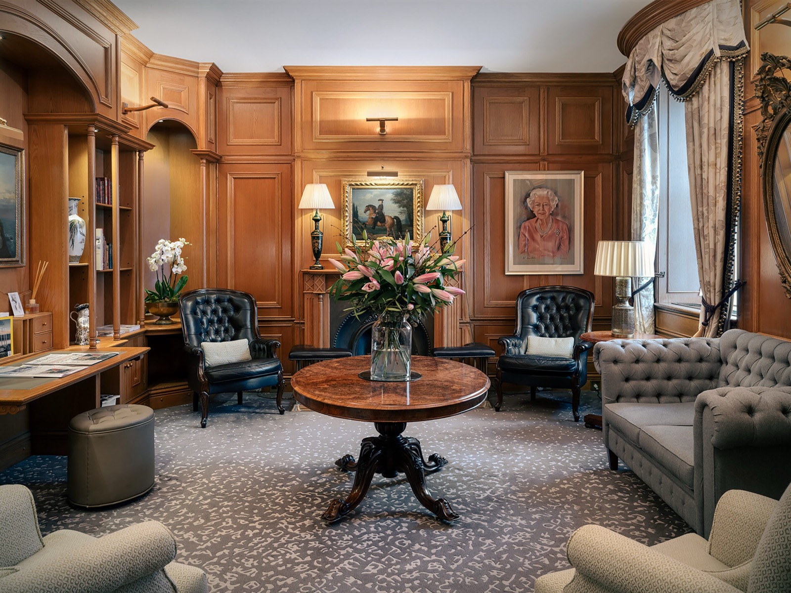 Panelled residents' lounge with leather armchairs