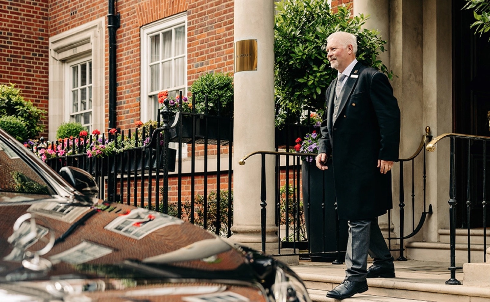 Doorman at the entrance steps