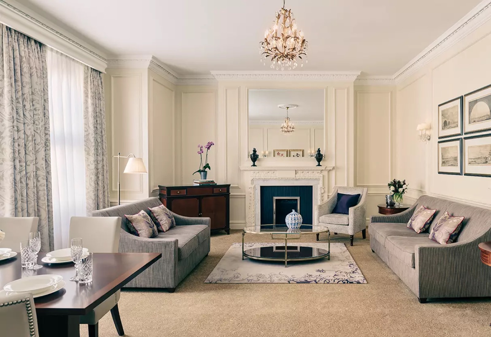 Drawing room with chandelier and carved fireplace
