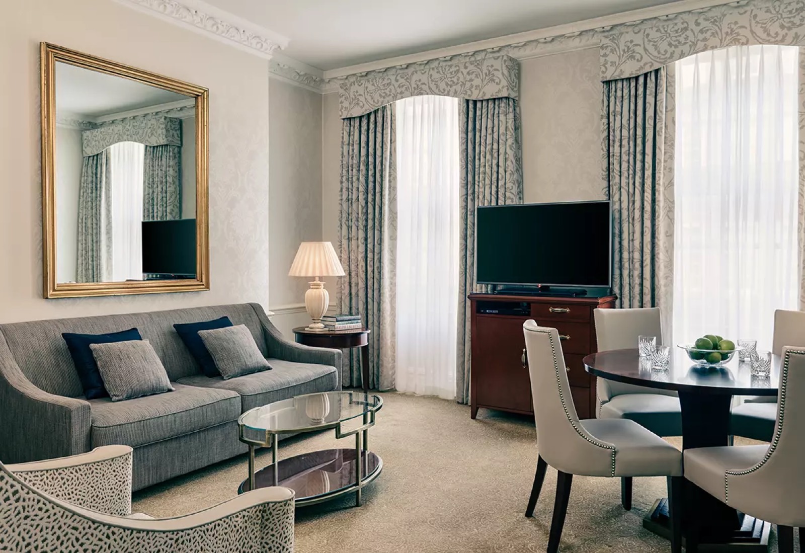 Grey sitting room with round dining table