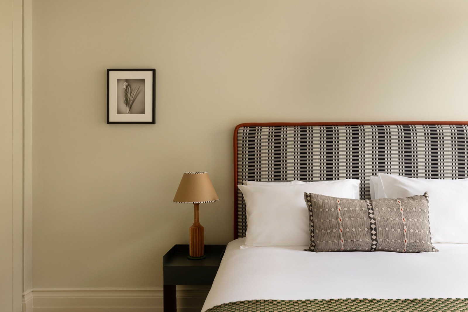 Super-king bed with checked headboard