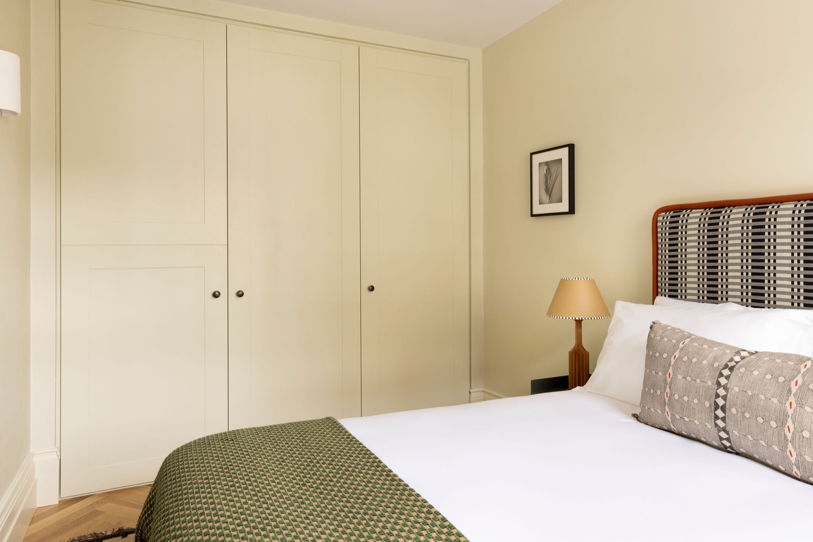 Fitted wardrobes beside the bed