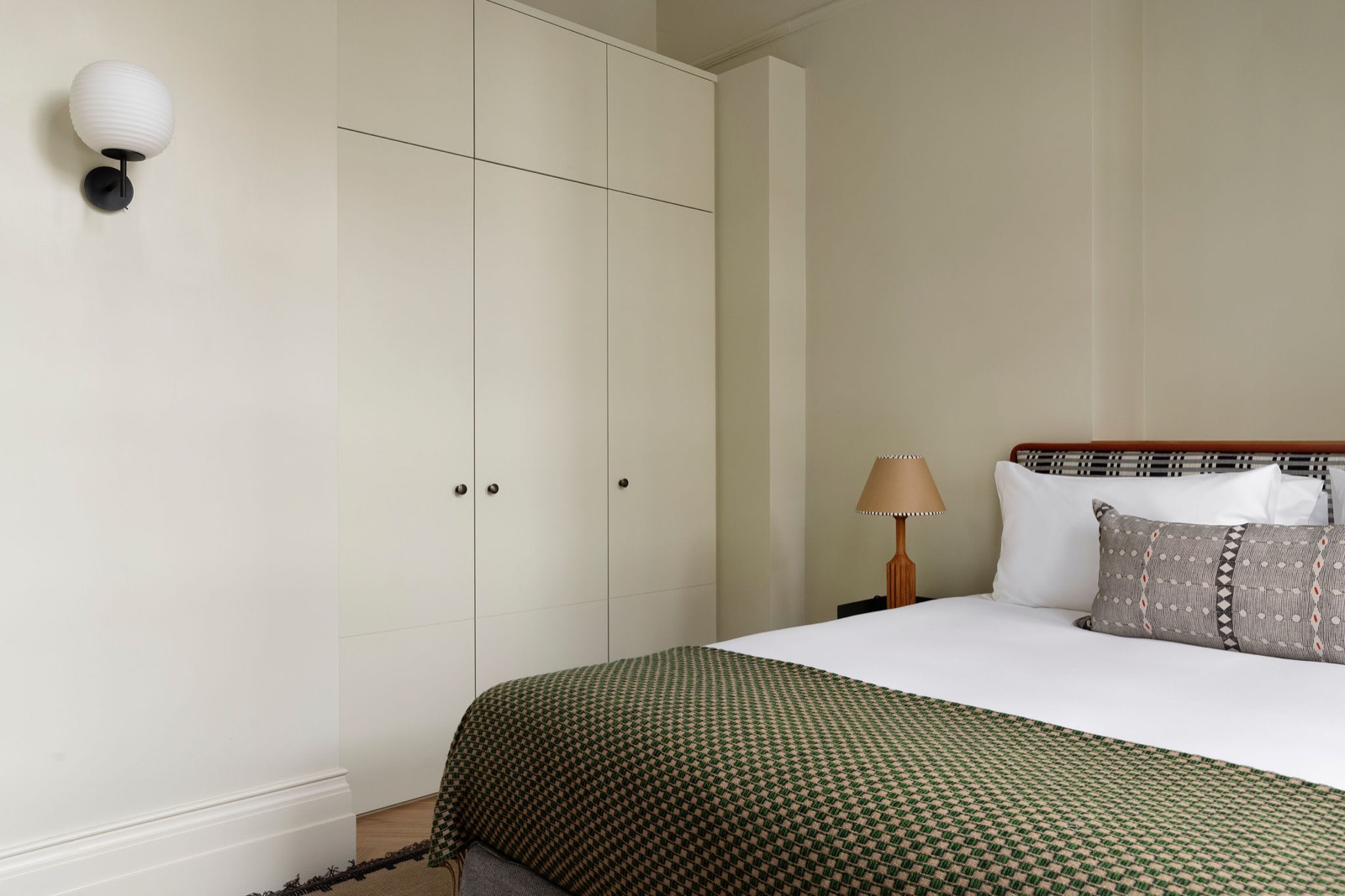 Fitted wardrobes beside the bed