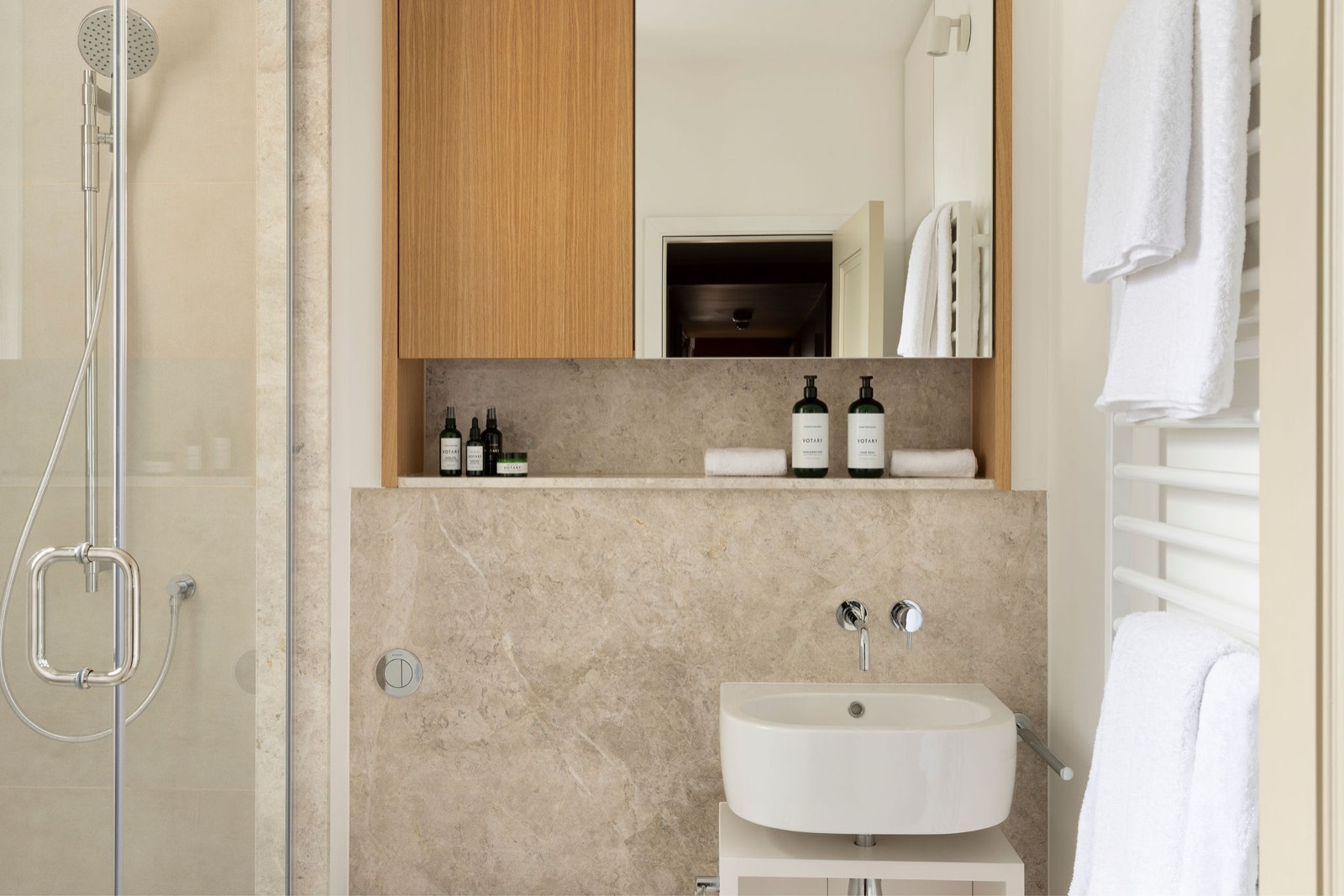 Shower room with stone-clad walls