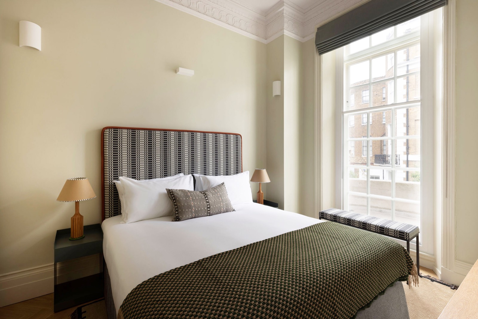 Bedroom with tall sash window and cornicing