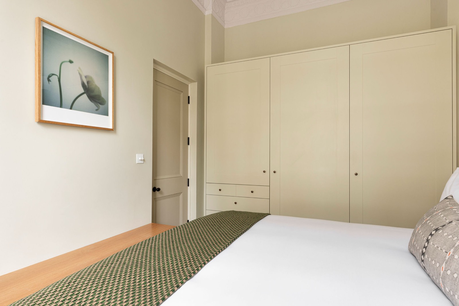 Fitted wardrobes along the bedroom wall