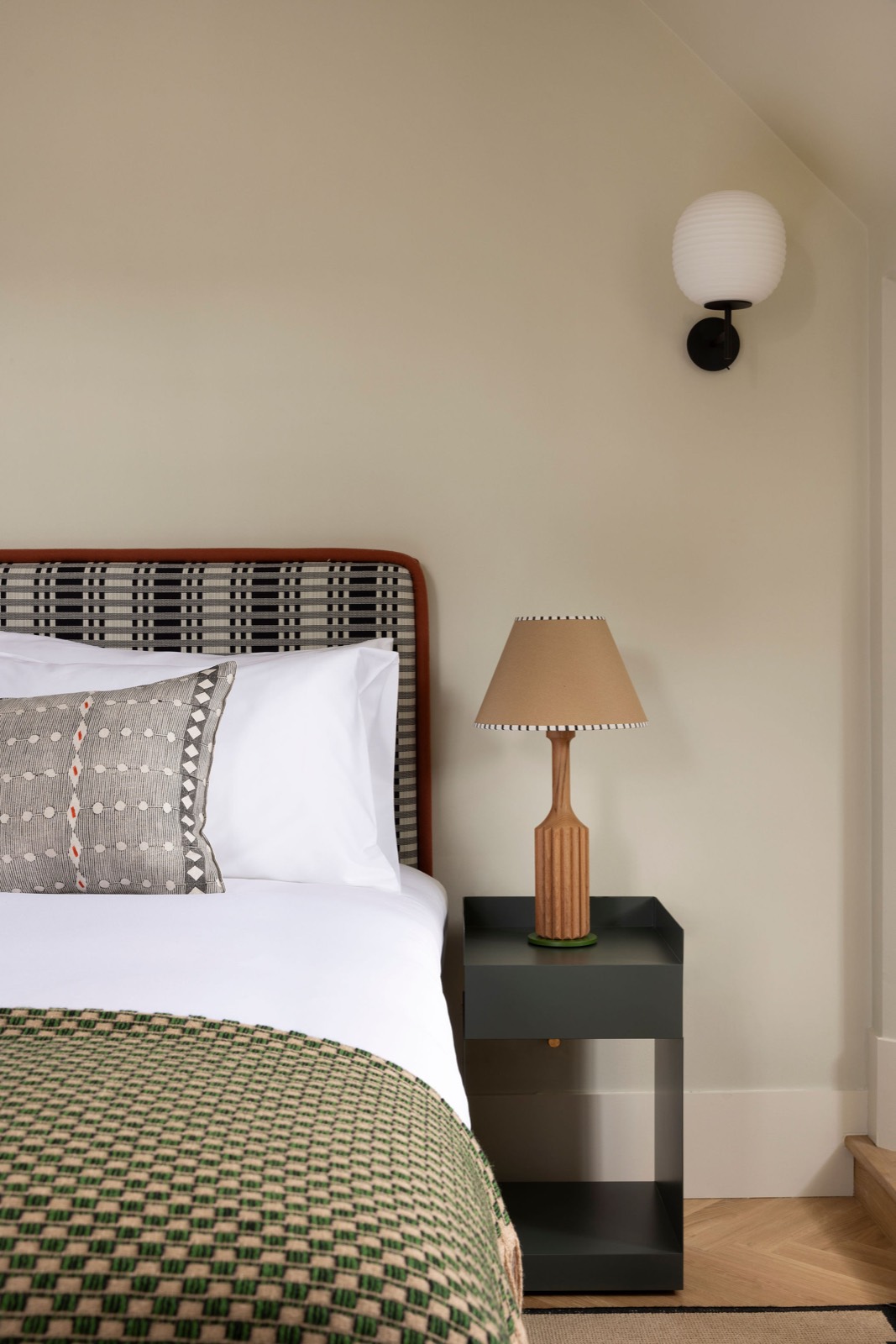 Checked headboard and bedside lamp