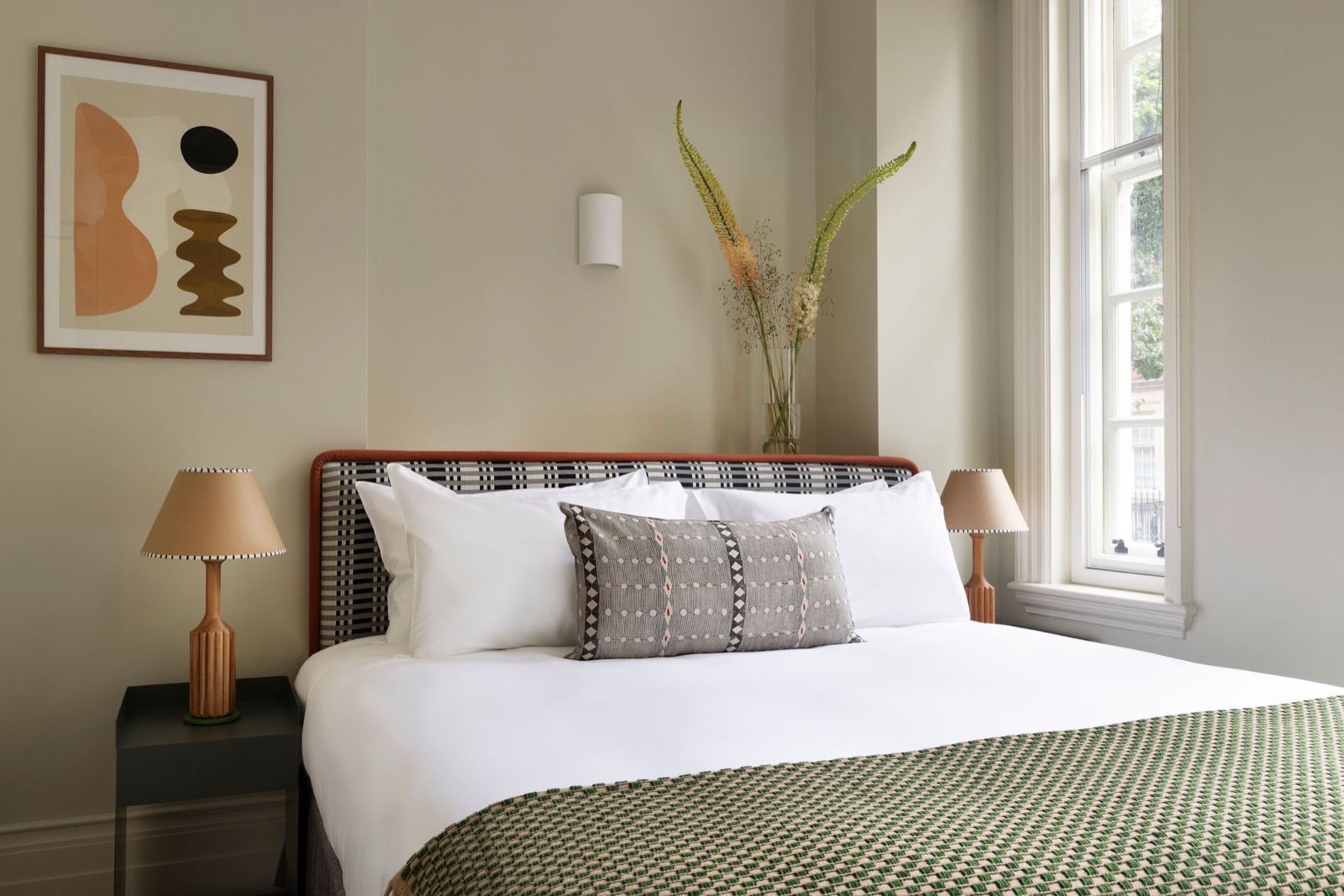 Bedroom with king bed by the window