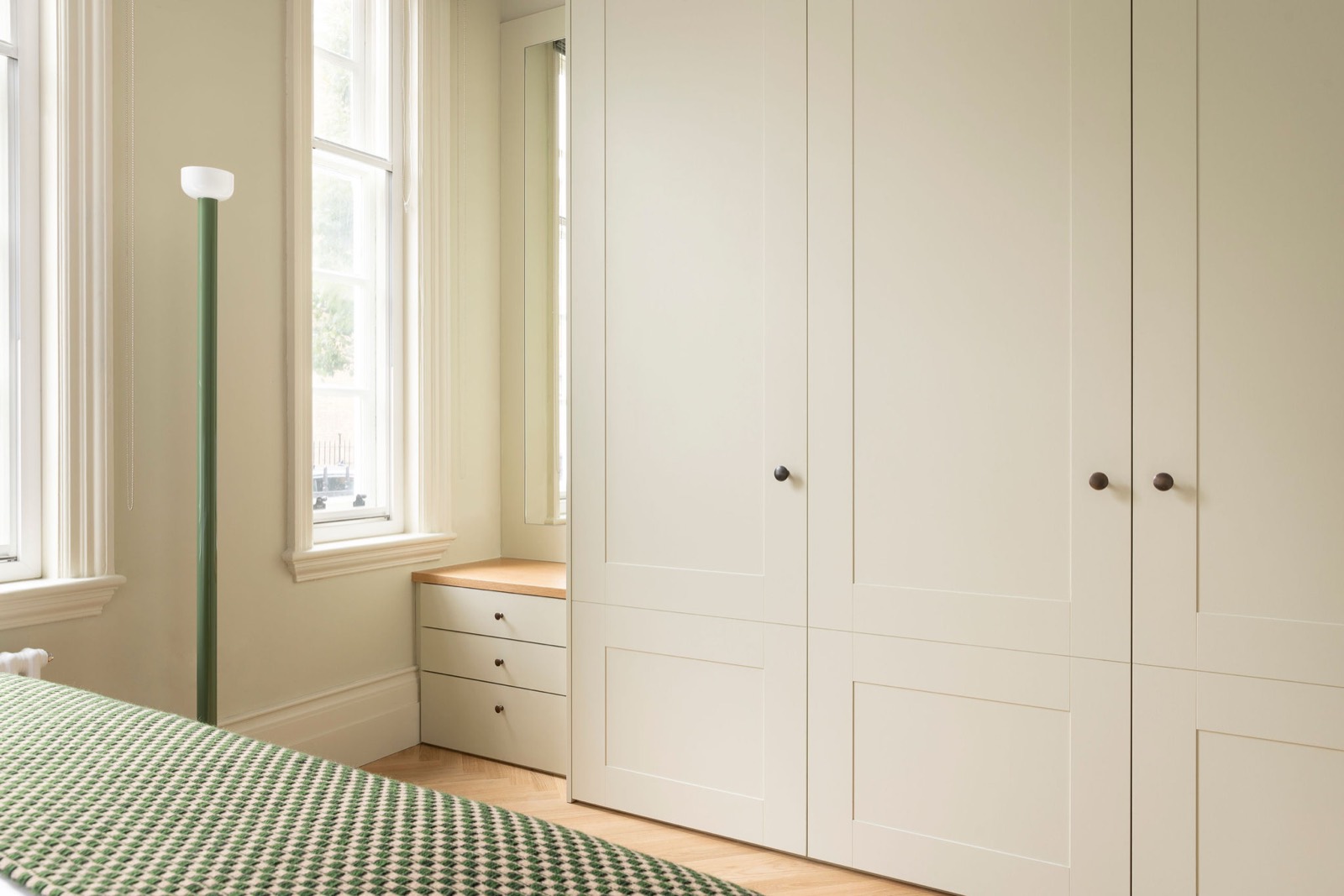 Fitted wardrobes beside the bedroom windows