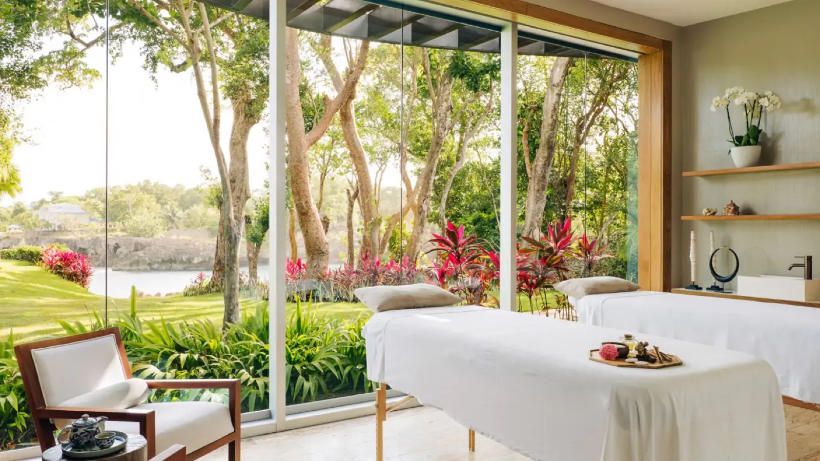 Massage room with glass walls onto the garden
