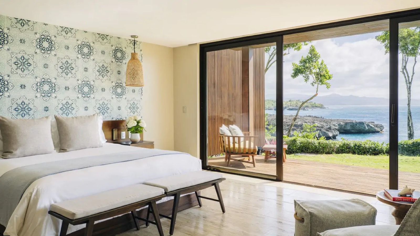 Bedroom with patterned tile wall facing the cove