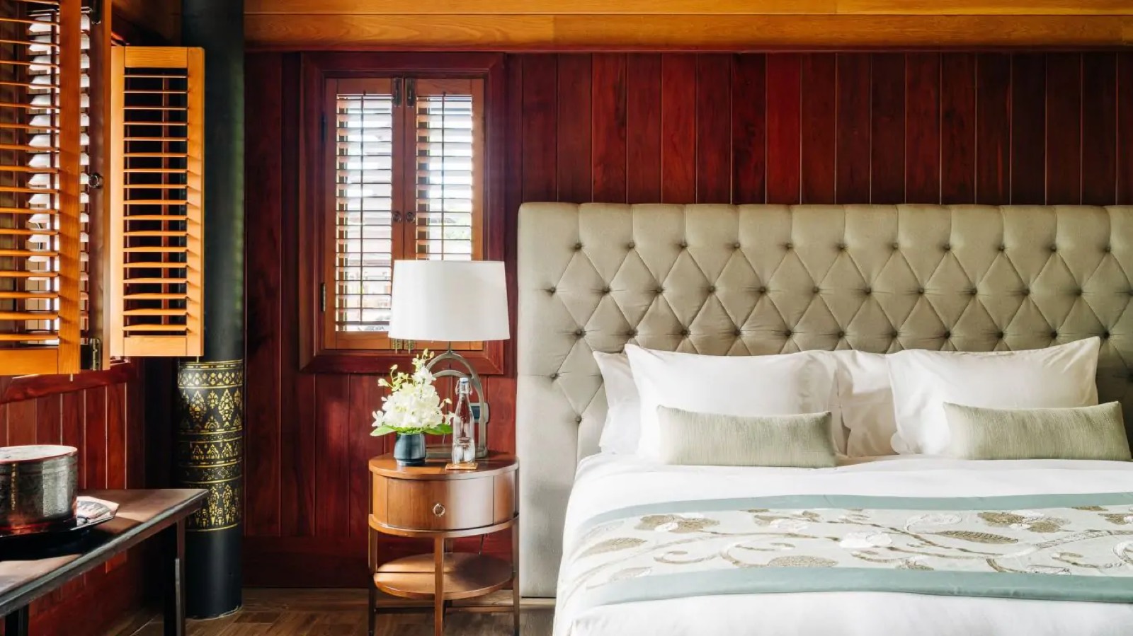 Guest bedroom with buttoned linen headboard