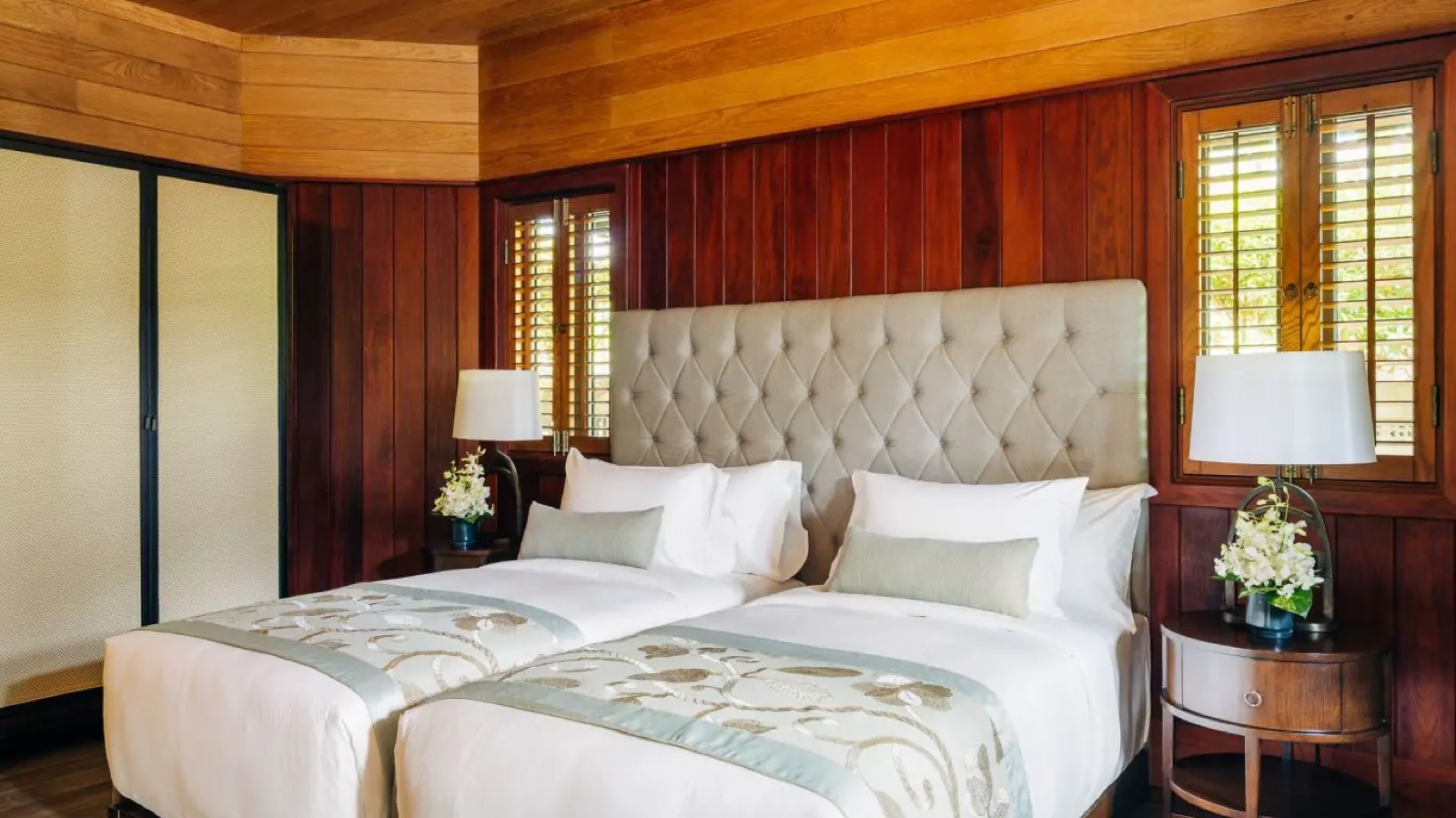 Twin bedroom with louvred timber shutters