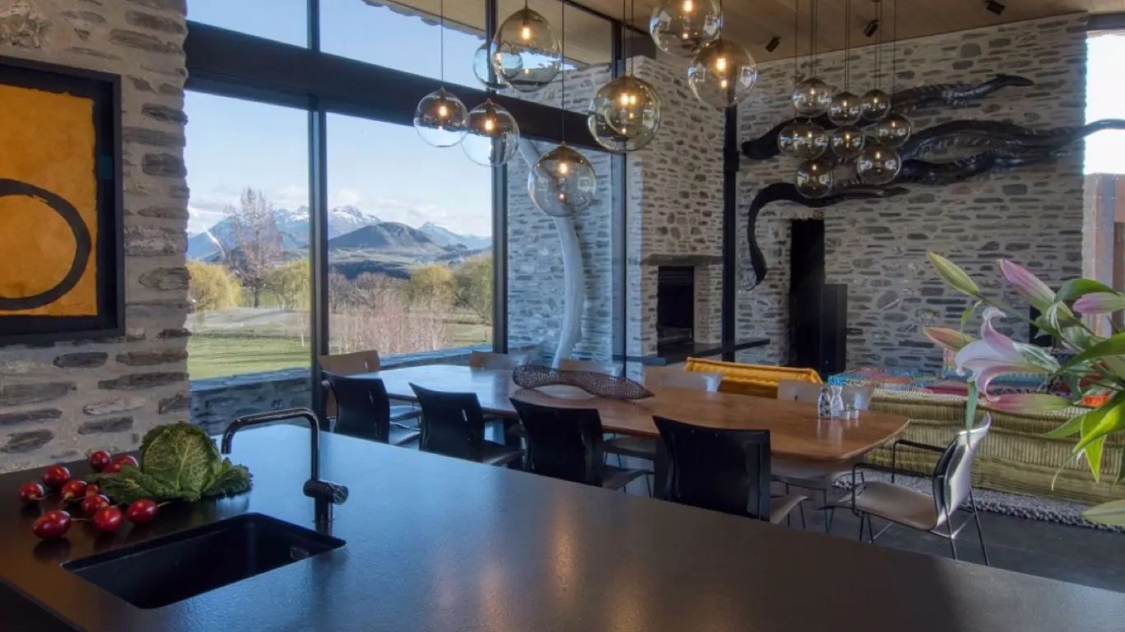 Dining table facing the mountains through glass