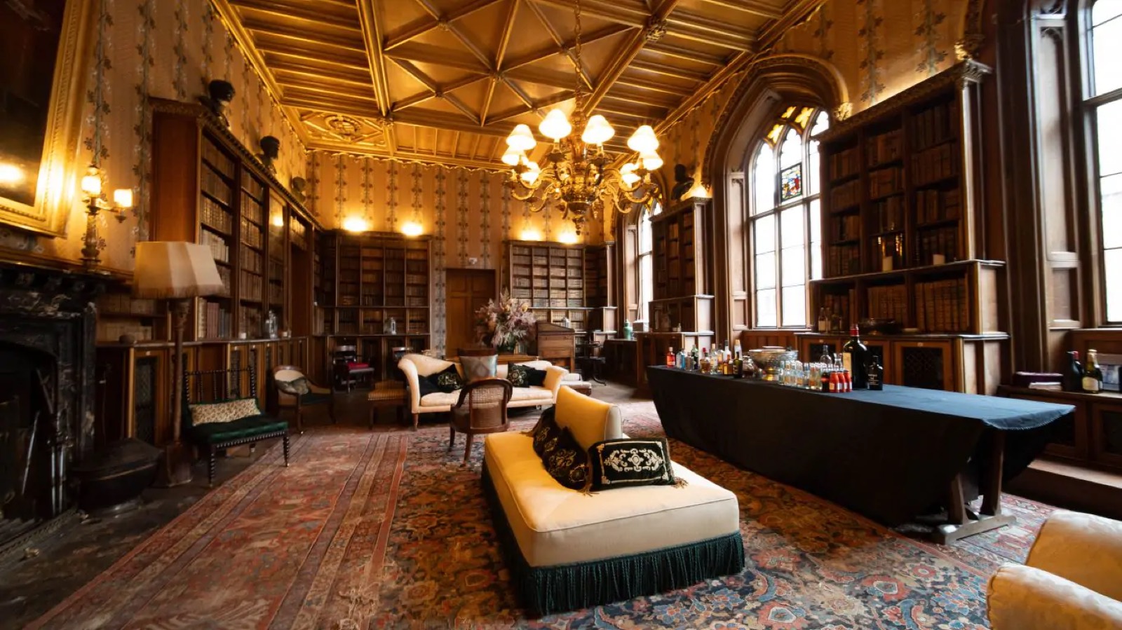 Library with vaulted ceiling and drinks table