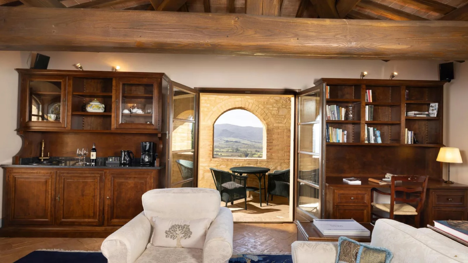 Sitting room opening to an arched loggia