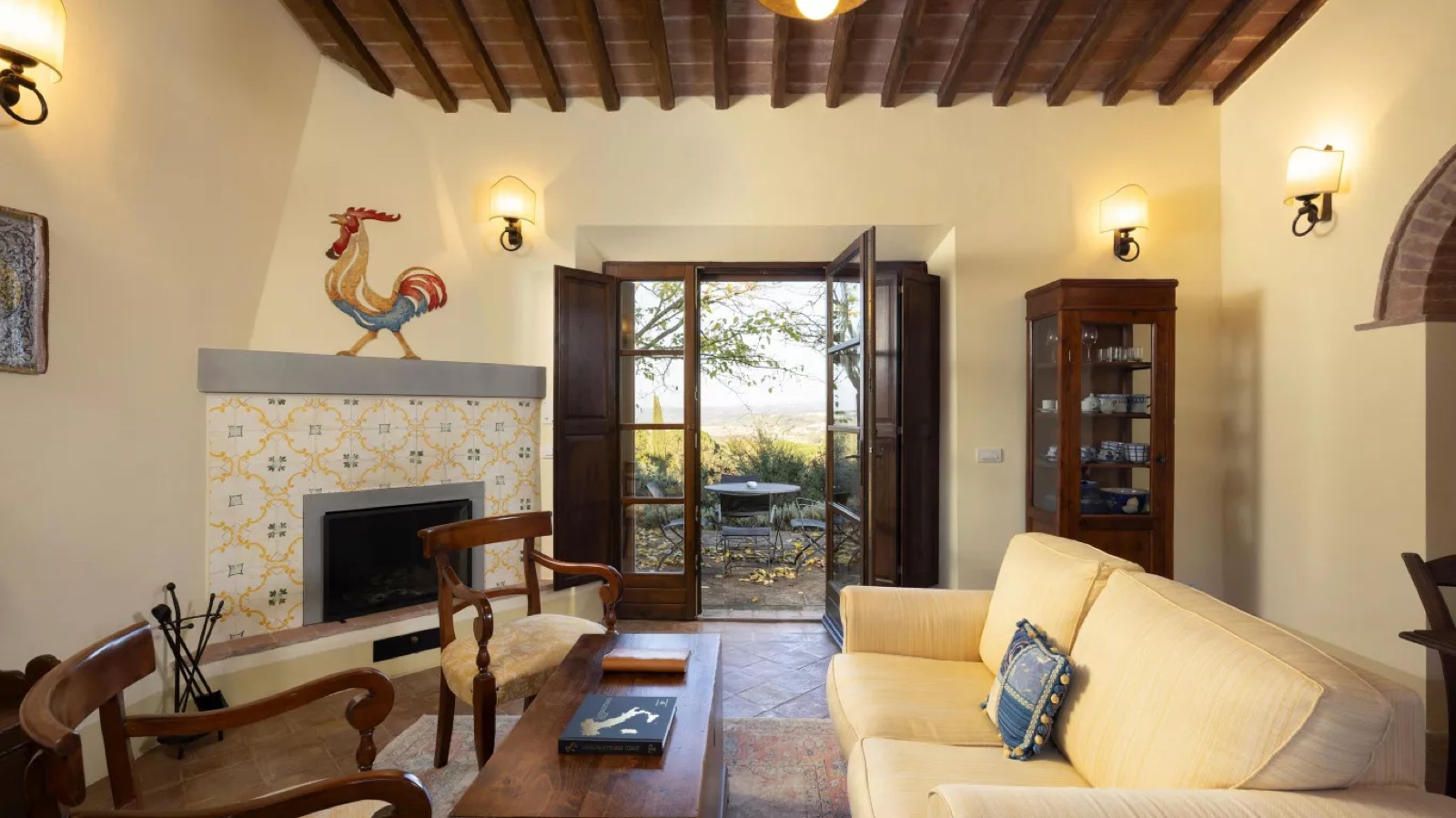 Sitting room with tiled fireplace and terrace doors