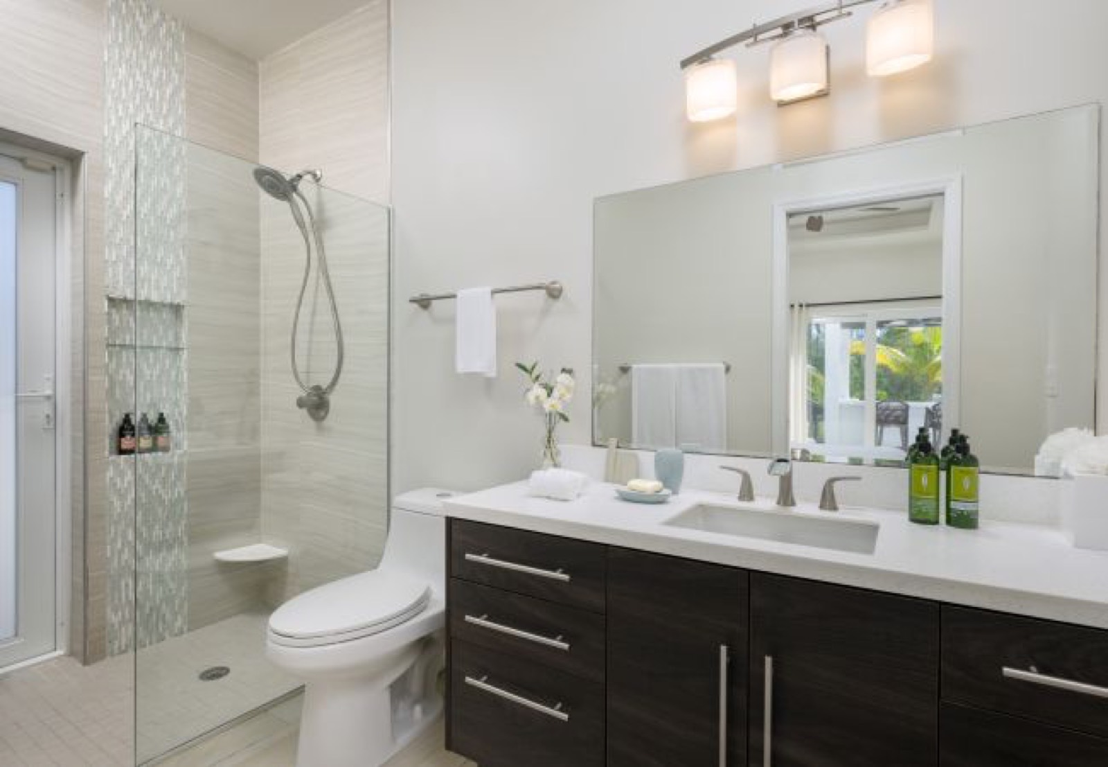 Bathroom with glass shower and single vanity