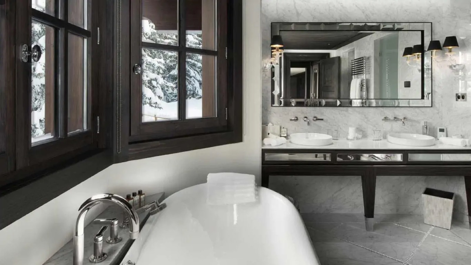 Bathroom with freestanding tub beside the window