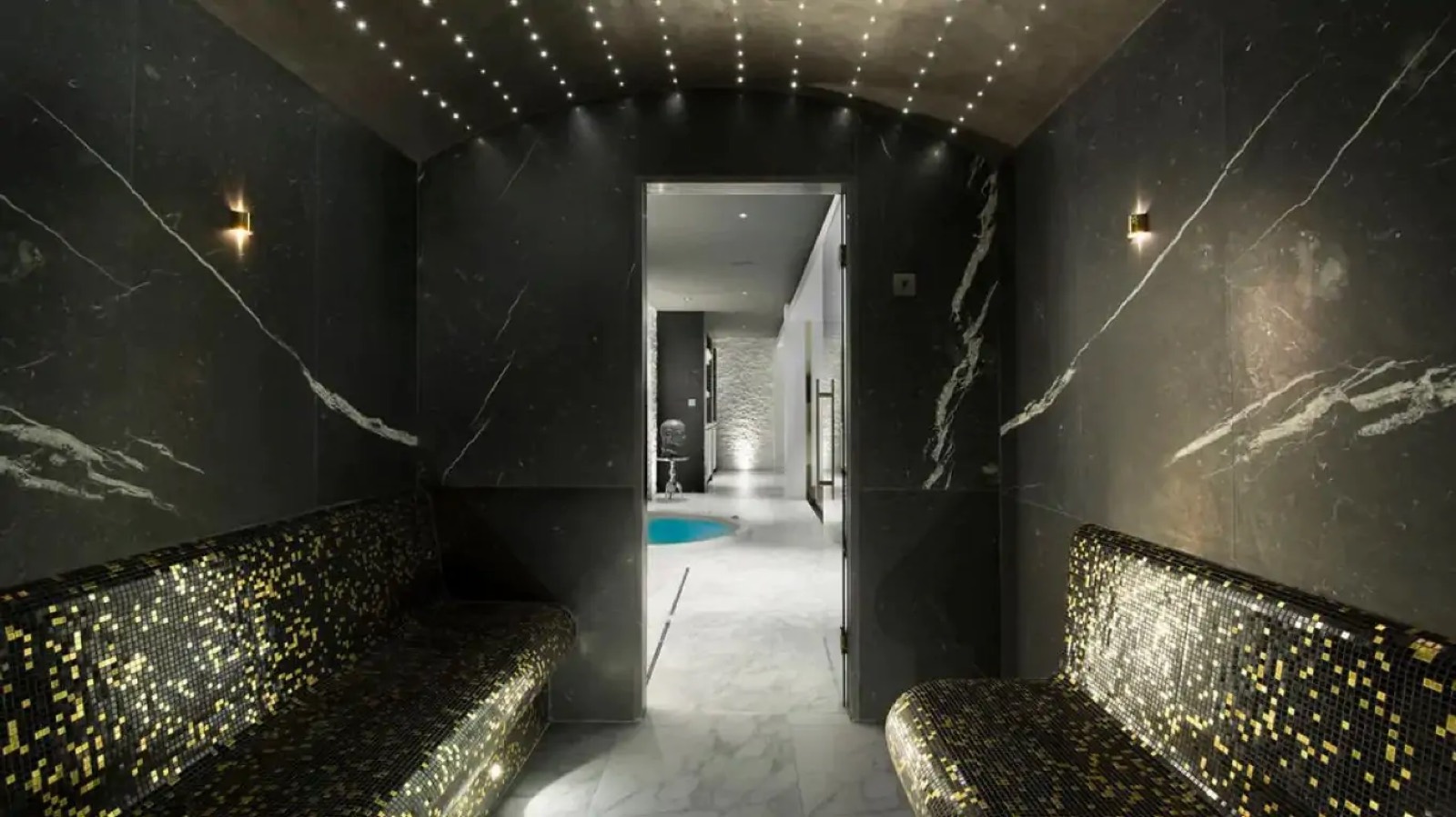 Hammam lined in black marble and gold mosaic