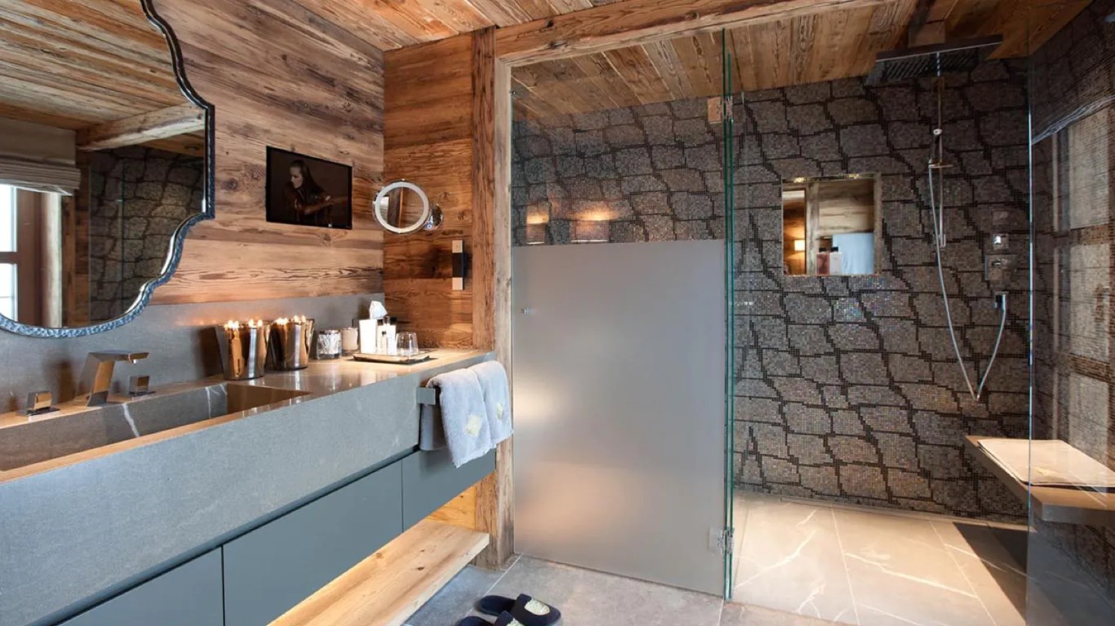 Bathroom with walk-in mosaic shower and stone vanity