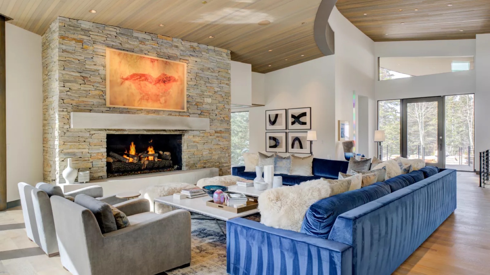 Living room with stacked stone fireplace