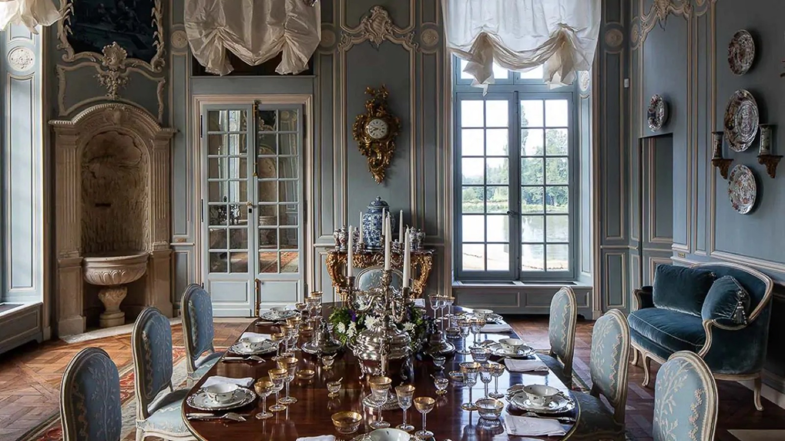 Formal dining room laid with silver and crystal