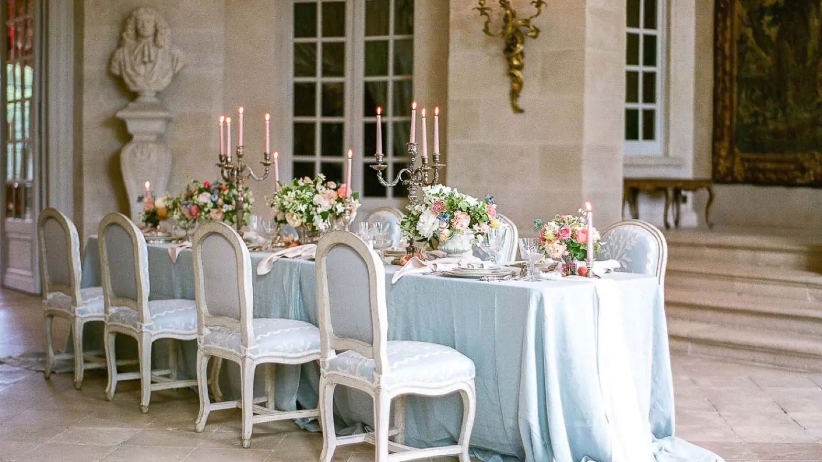 Candlelit table laid in the stone hall