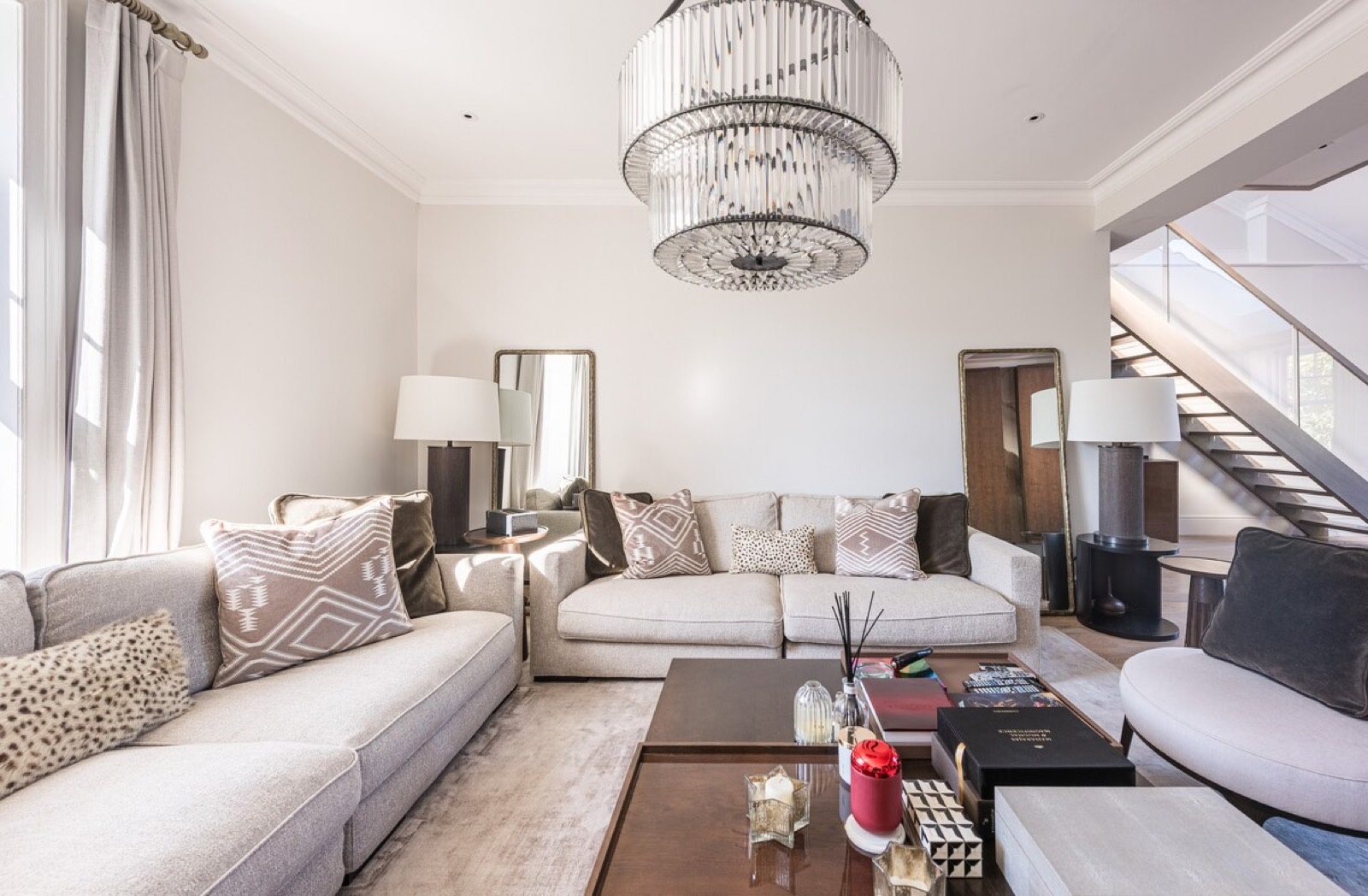 Sofas beneath the tiered glass chandelier