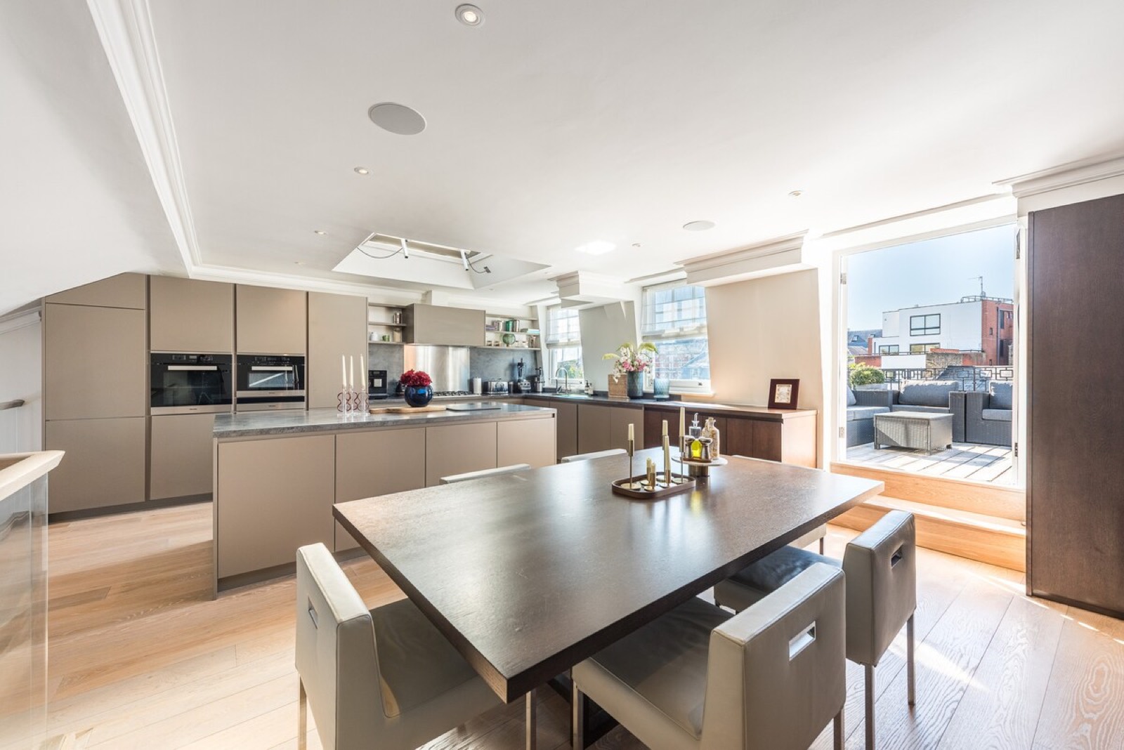 Dining table set beside the kitchen island