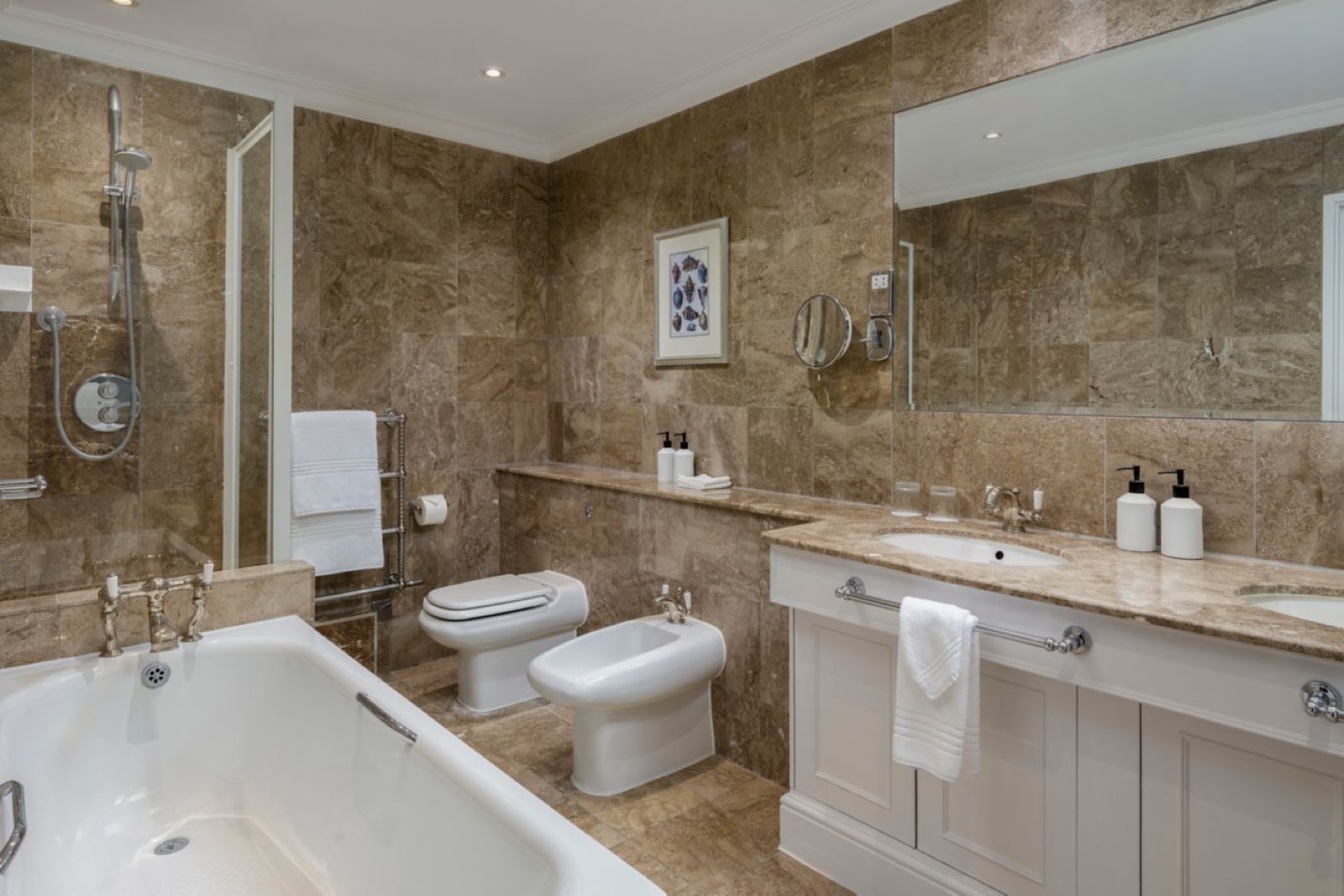 Marble bathroom with bath and separate shower