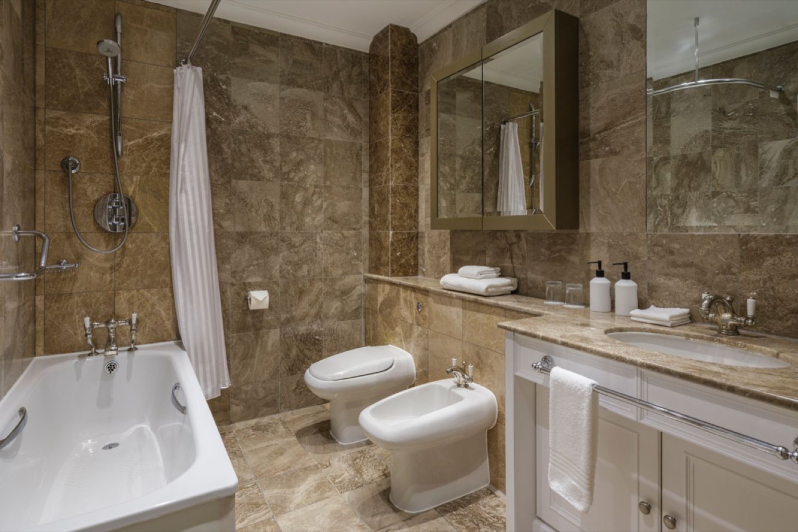 Marble bathroom with bath and bidet