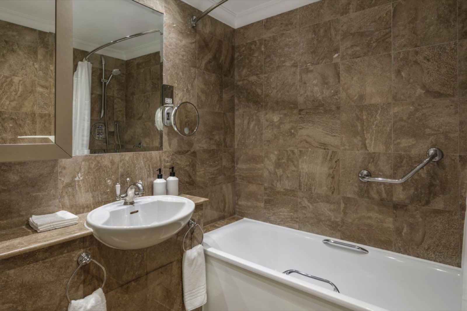 Second bathroom with bath and basin