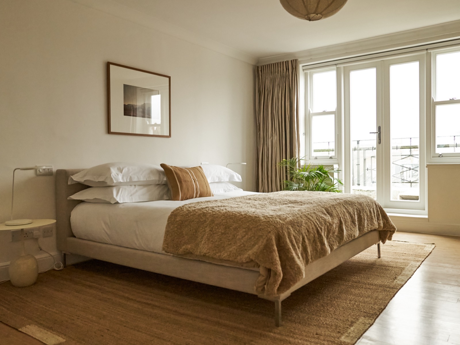 Bedroom with doors onto a private terrace
