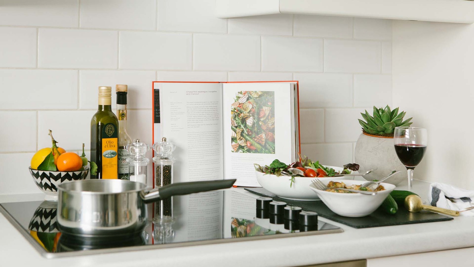 Kitchen worktop with induction hob and tiled splashback