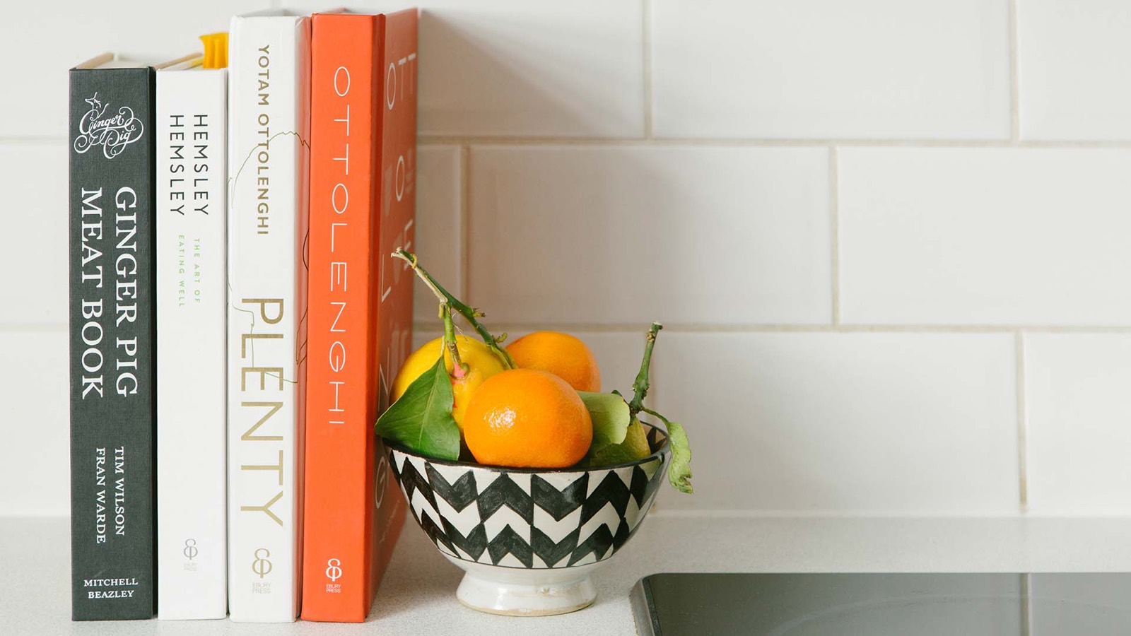 Cookbooks and a bowl of citrus