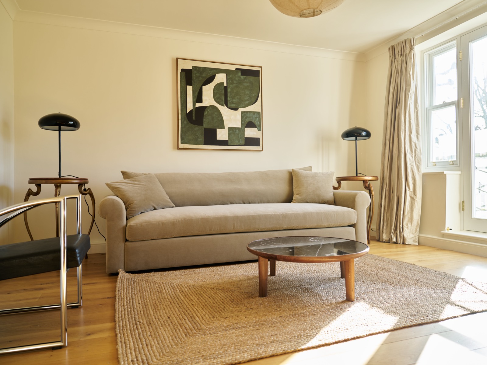 Sitting room with jute rug and artwork