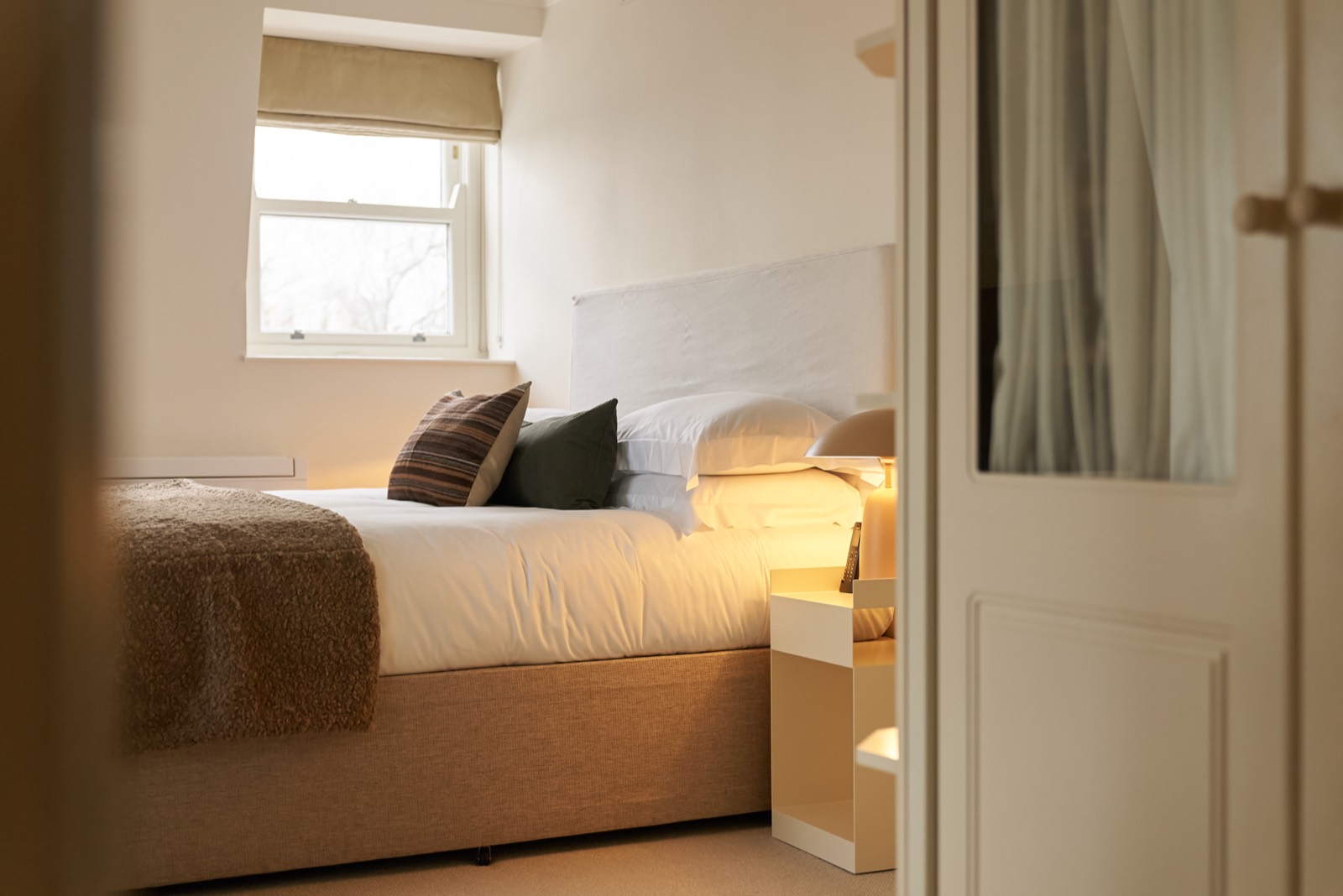 Double bedroom with mirrored wardrobe alongside