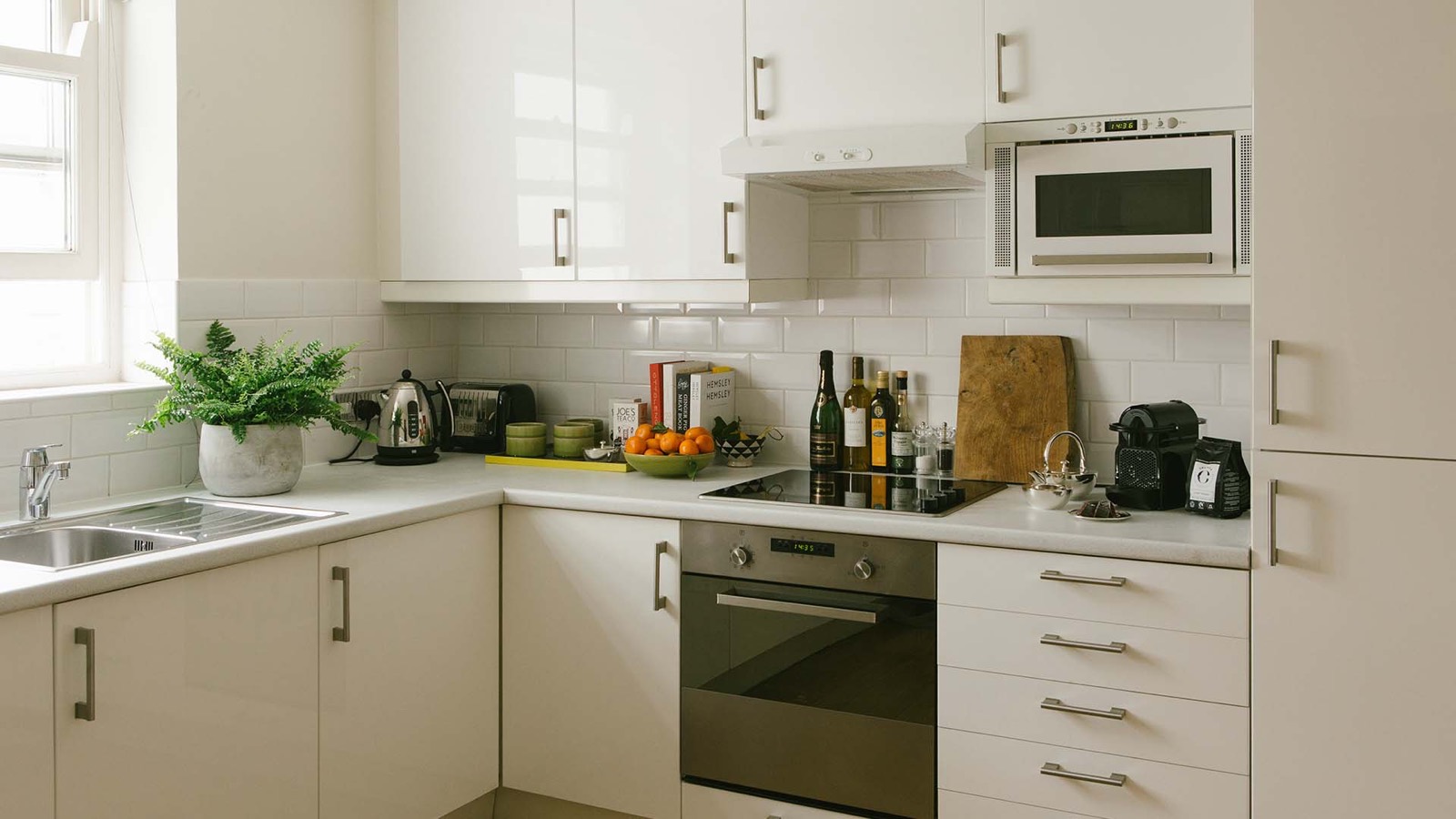Fitted kitchen with oven and hob