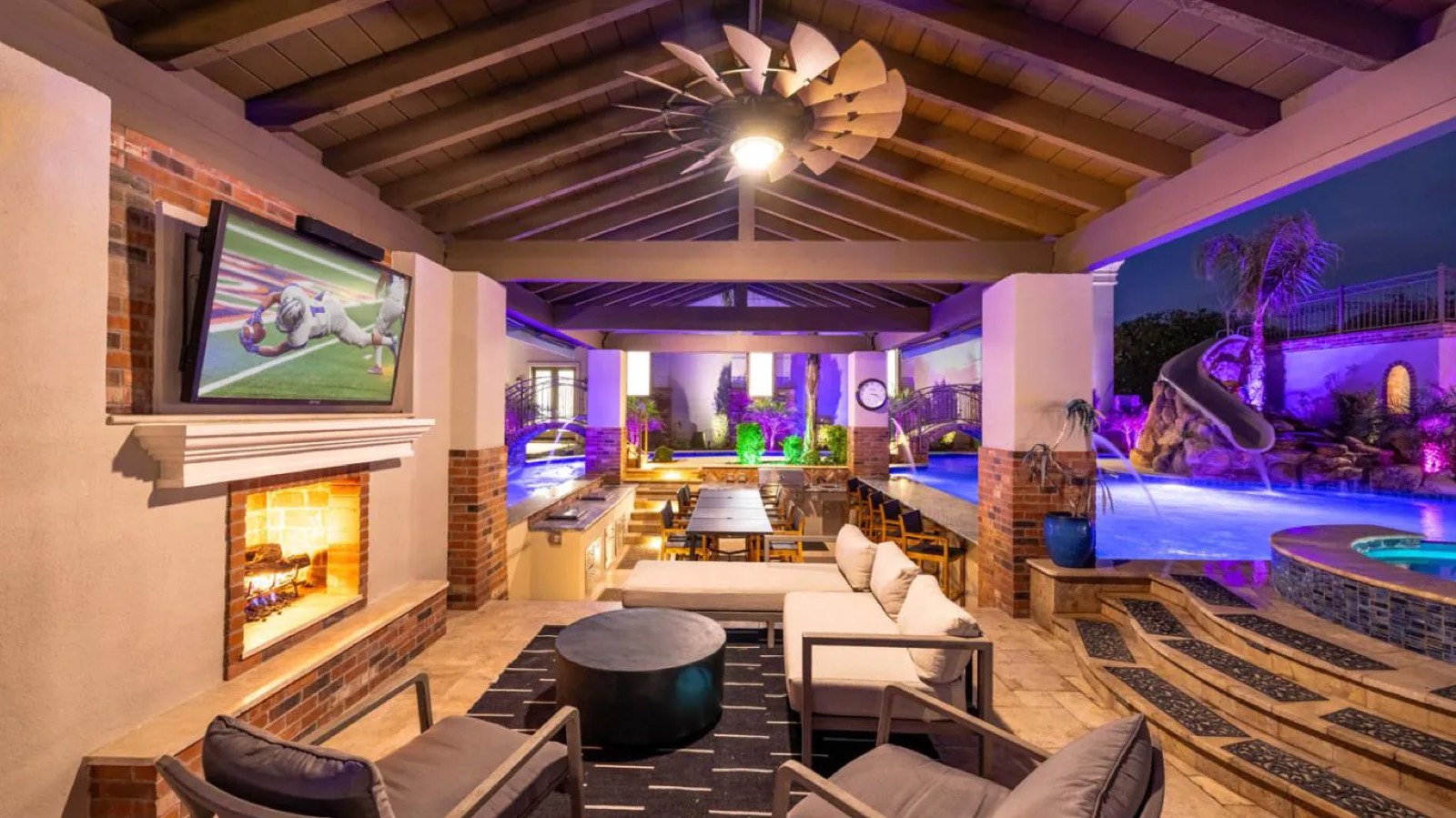 Covered terrace with fireplace and swim-up bar