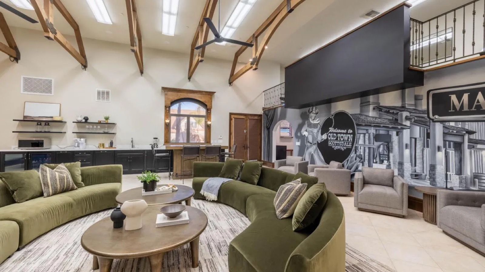 Lounge with wet bar and painted mural