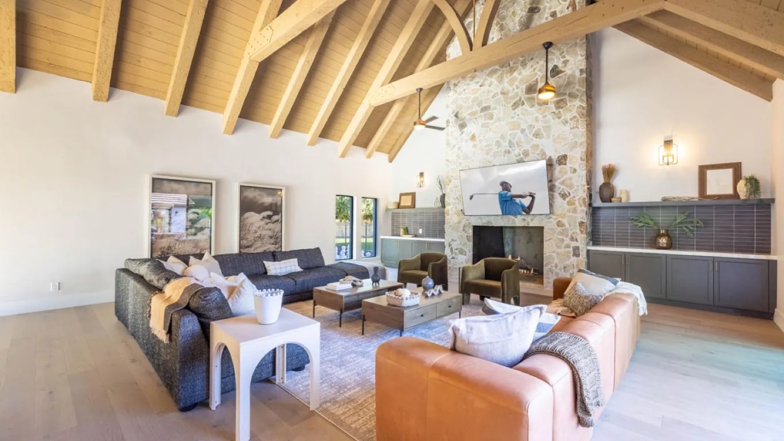 Living room with tall stone fireplace