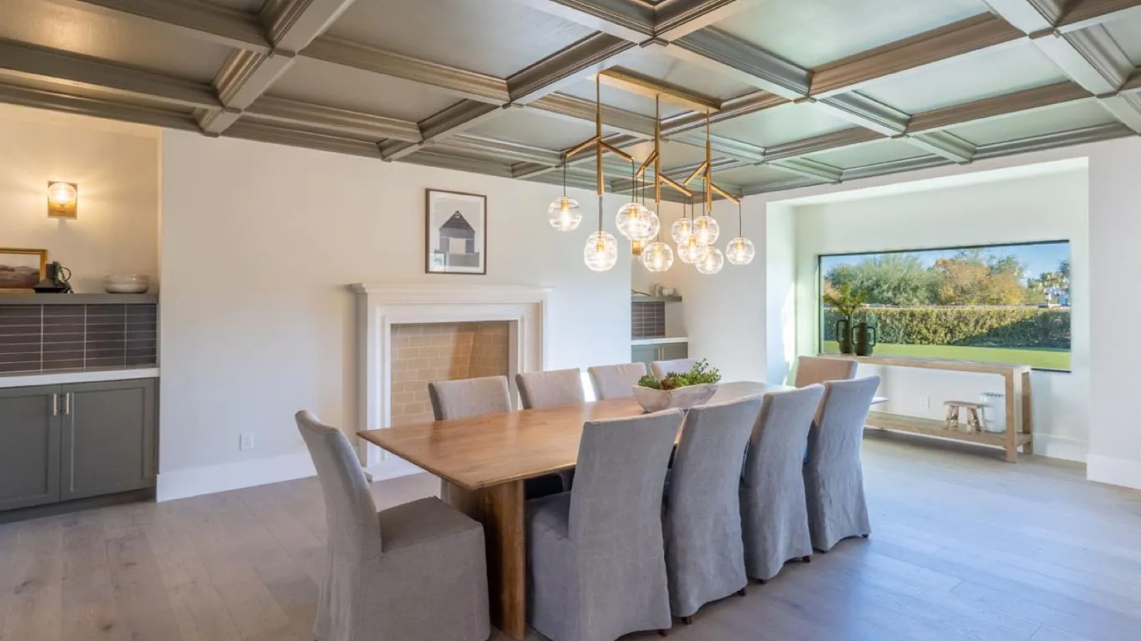Dining room with coffered ceiling and fireplace