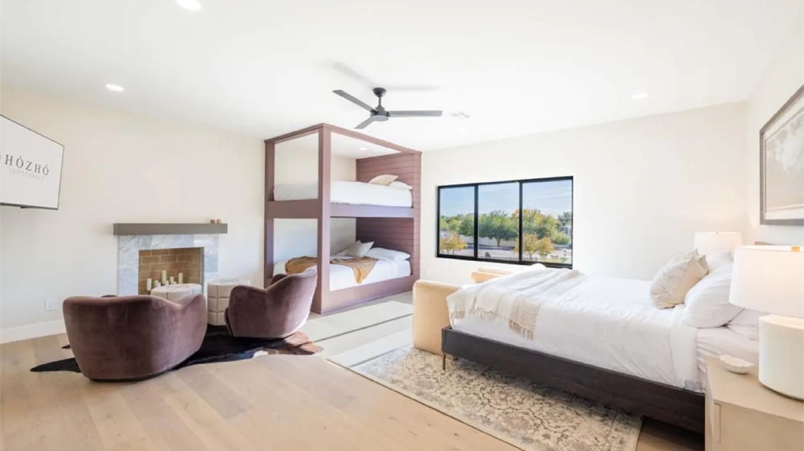 Bedroom with built-in bunks and fireplace