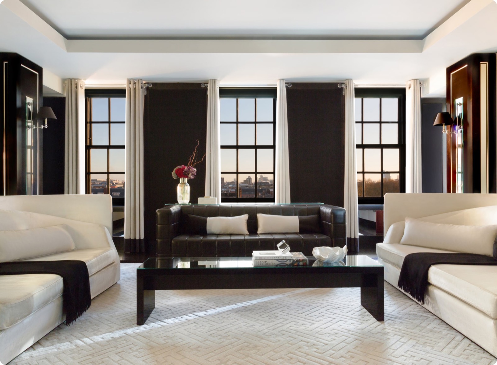 Sitting room with tall windows at dusk
