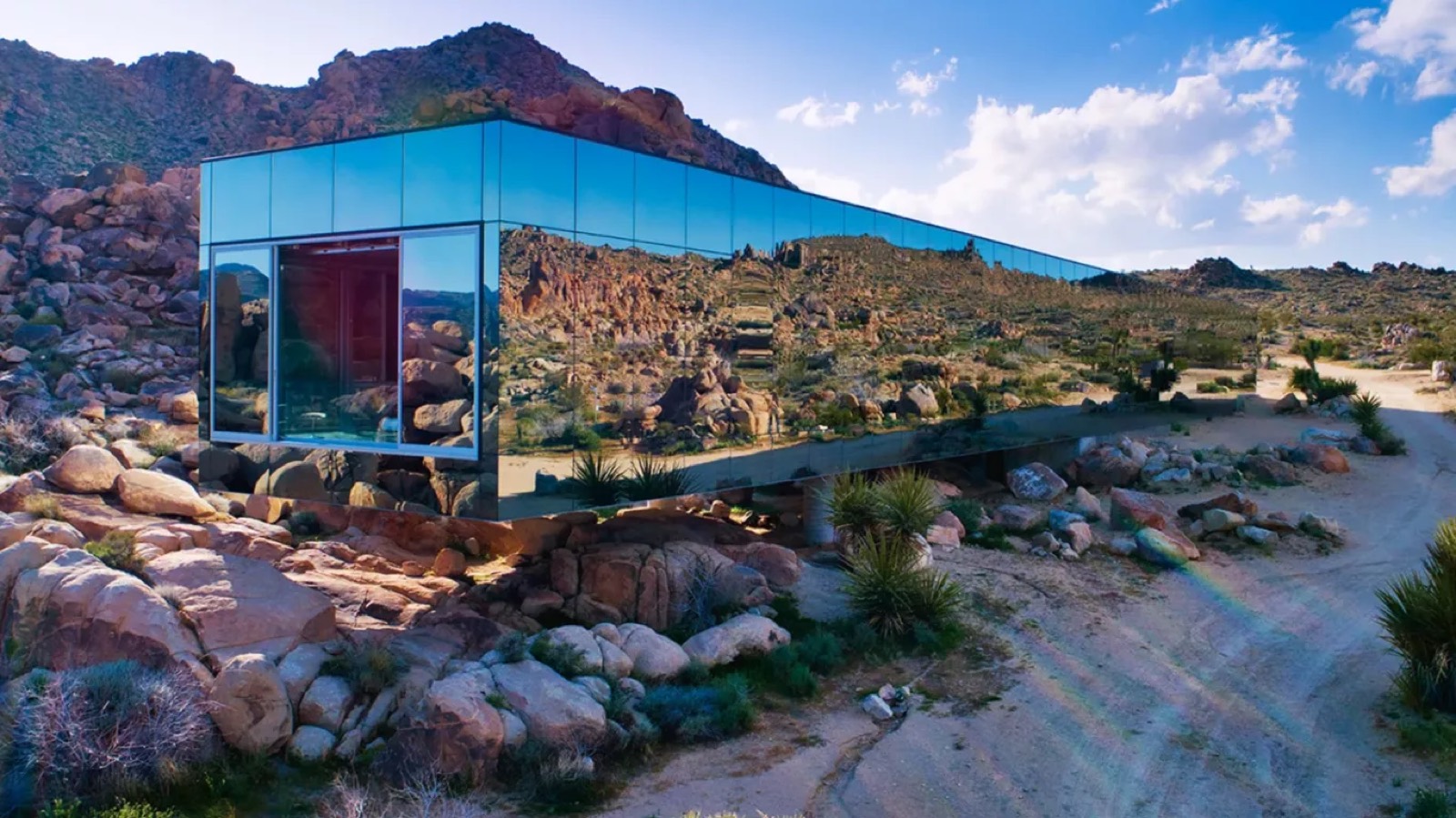 Mirrored facade reflecting the boulder field