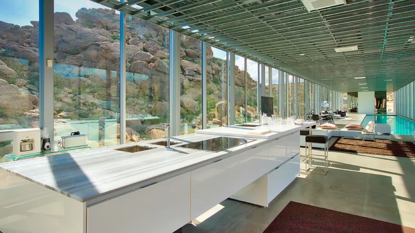Kitchen island facing the boulders through glass