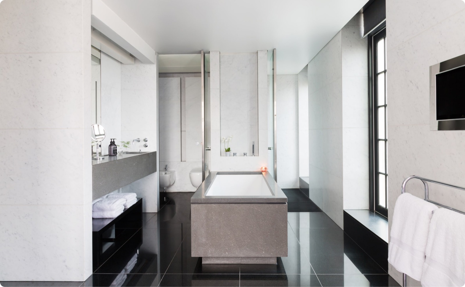 Marble bathroom with freestanding stone bath