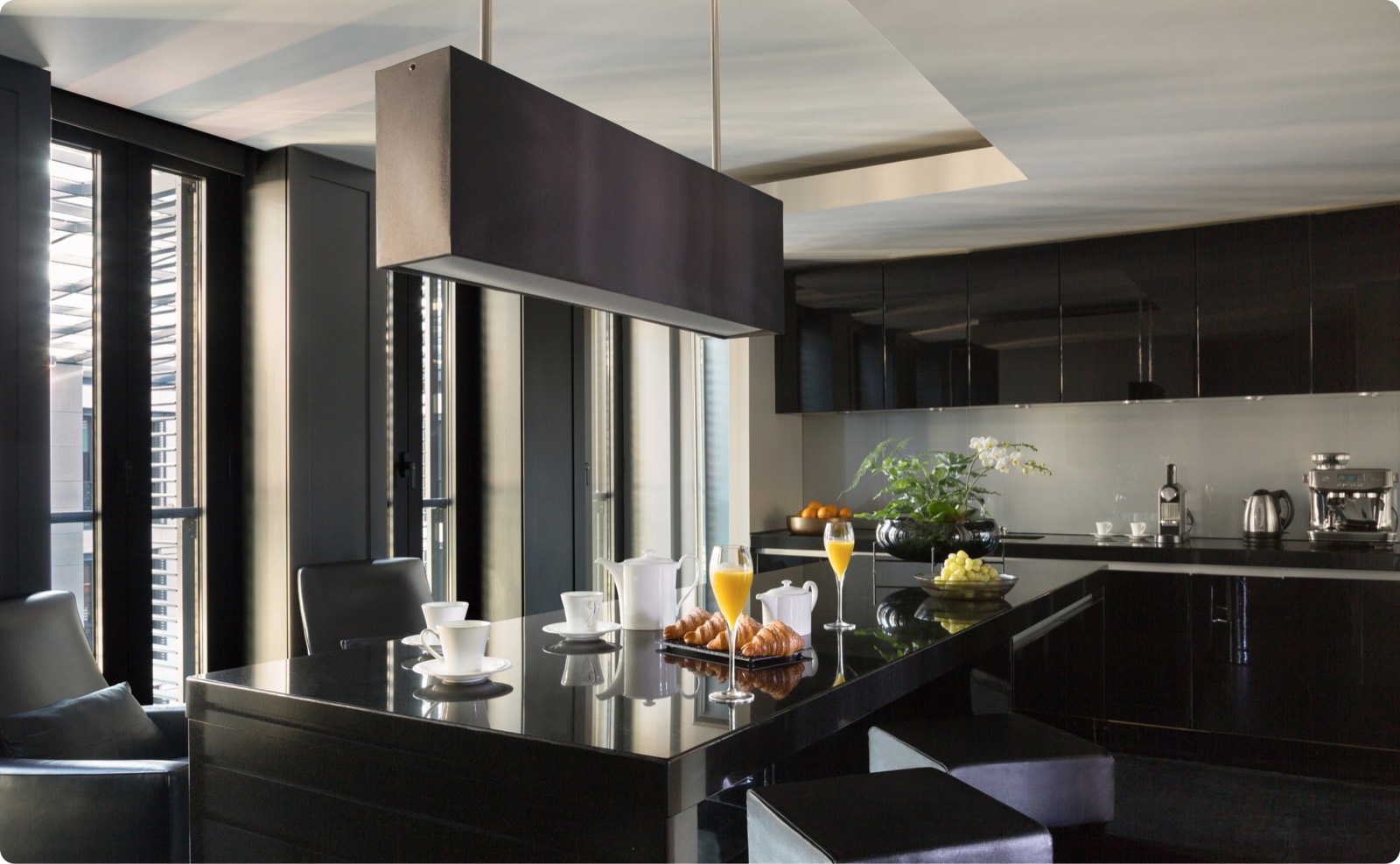 Kitchen with breakfast bar and dark cabinetry