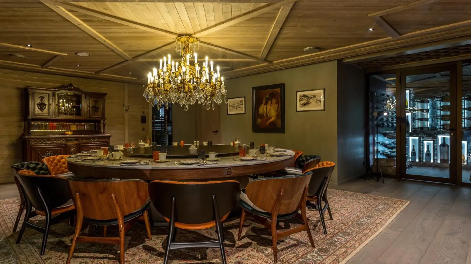Dining room with round table and wine cellar